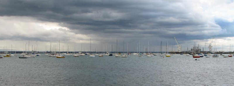 storm clouds approaching moored boats